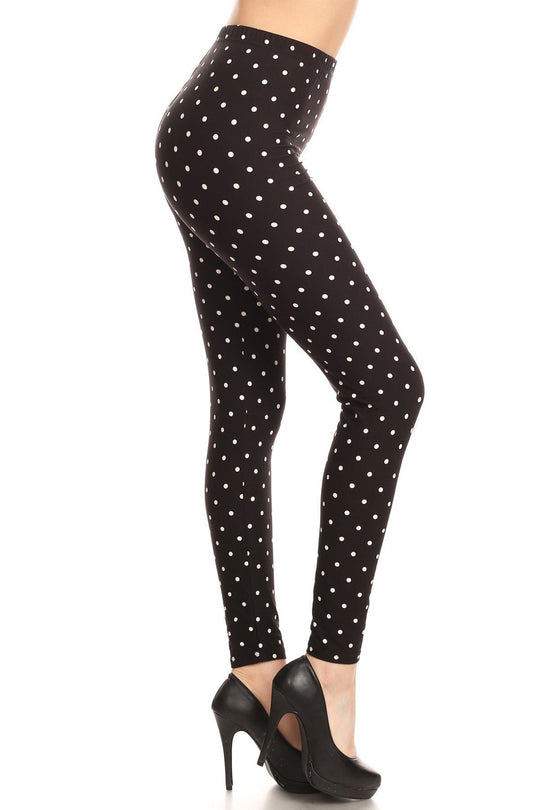 High Waisted Leggings With An Elastic Band In A White Polka Dot Print Over A Black Background